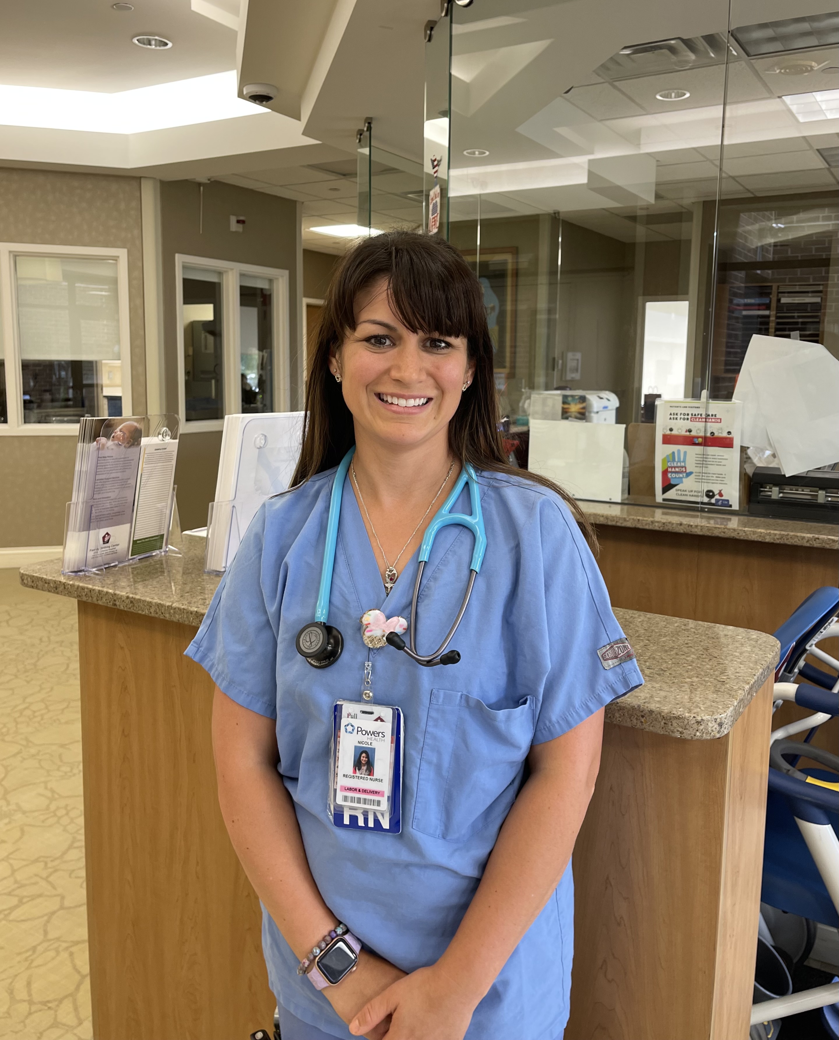 Nicole Neel, RN standing outside the nurses station